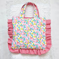 Pochette à volants tissu vichy rouge et tissu fleuri