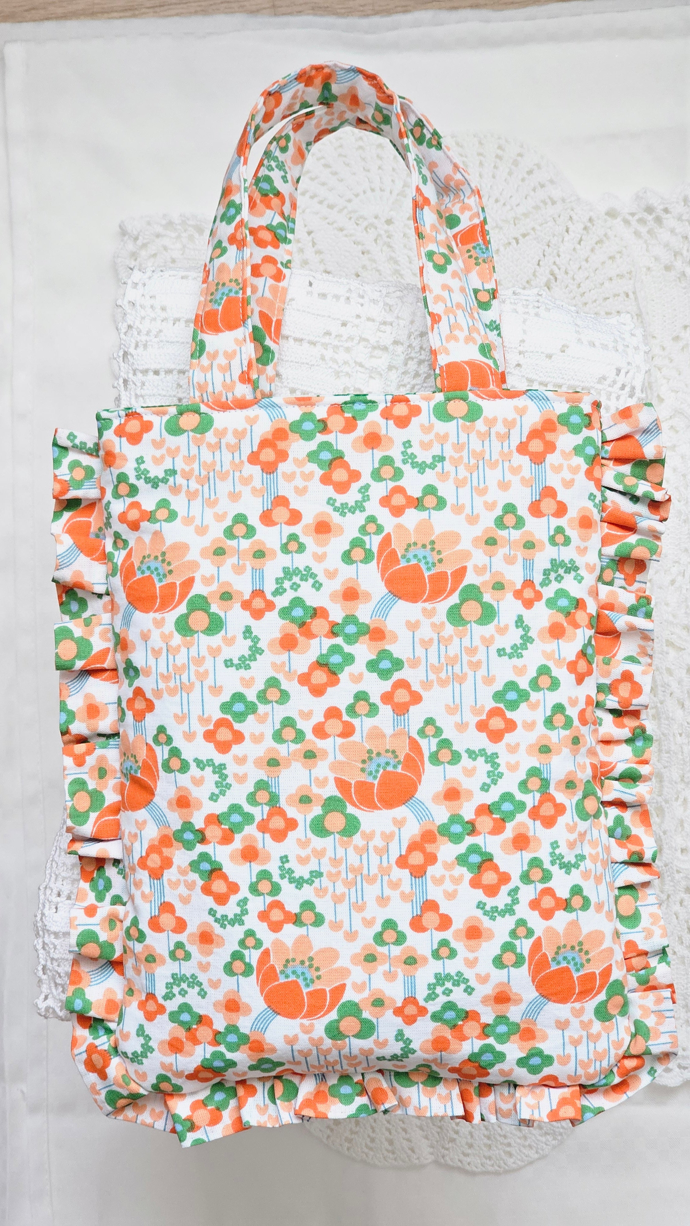 Sac à volants et trousse tissu fleuri orange