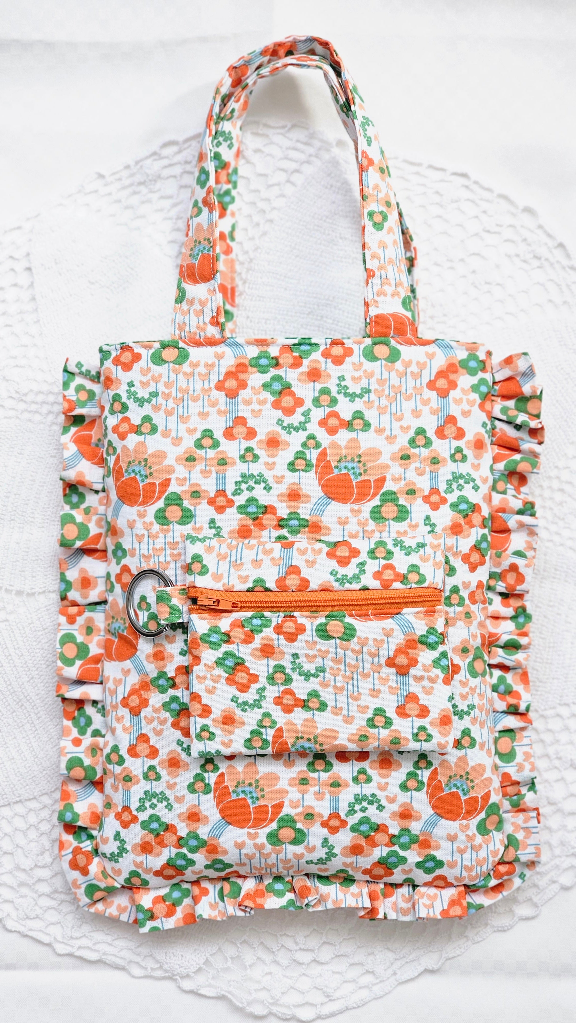 Sac à volants et trousse tissu fleuri orange