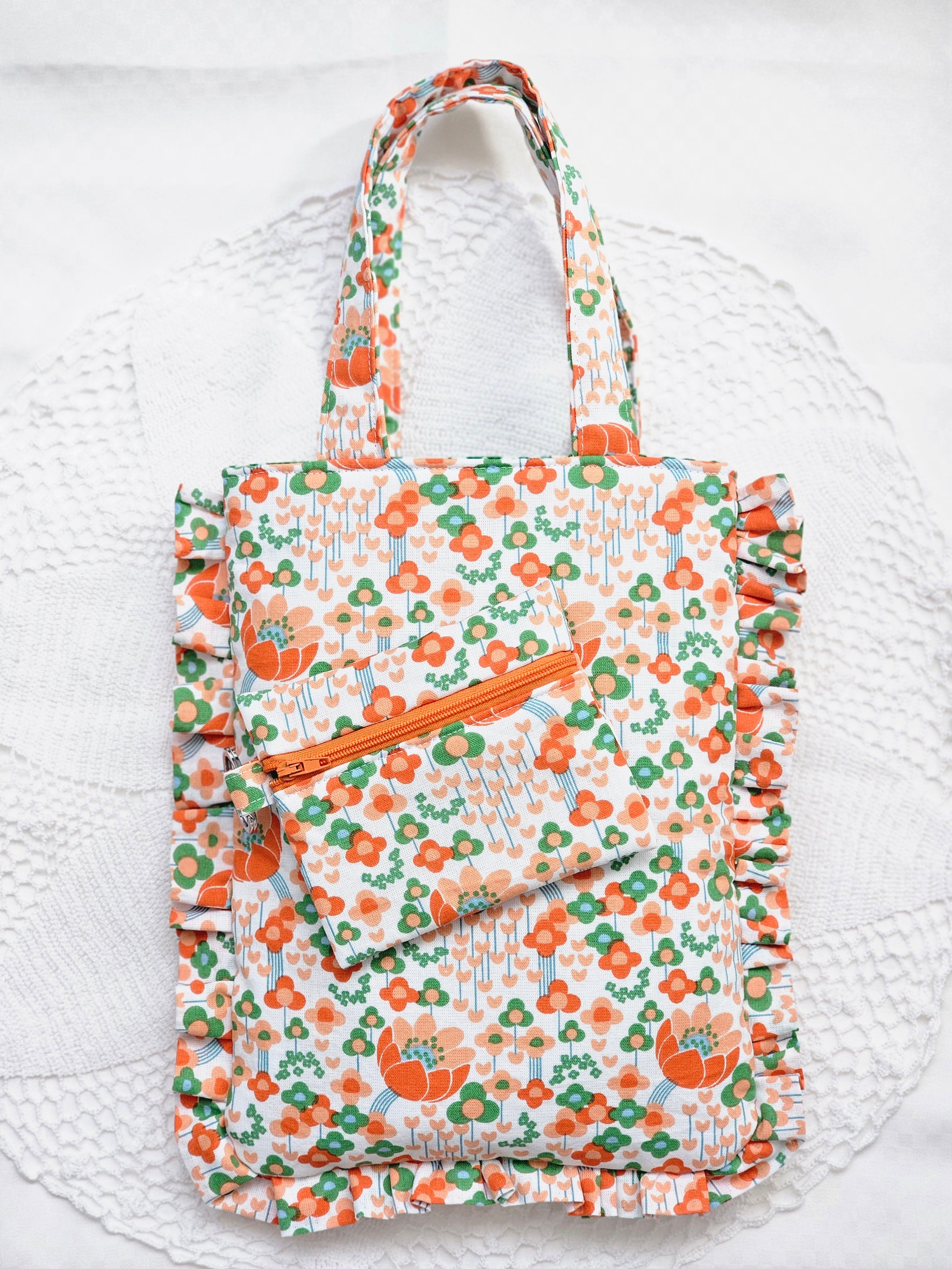 Sac à volants et trousse tissu fleuri orange