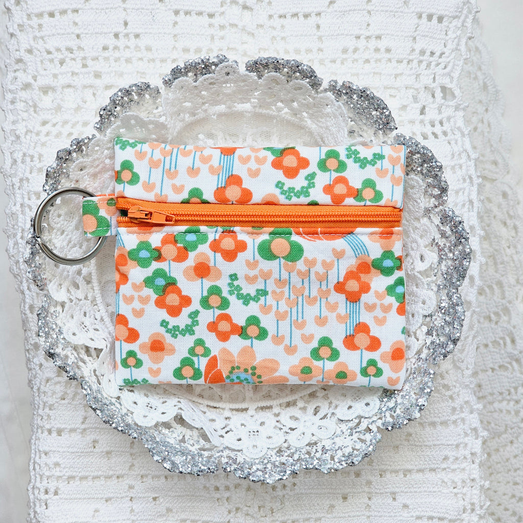 Sac à volants et trousse tissu fleuri orange